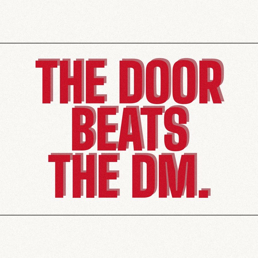Screen-print poster reading "The door beats the DM." in heavy red condensed type on paper.