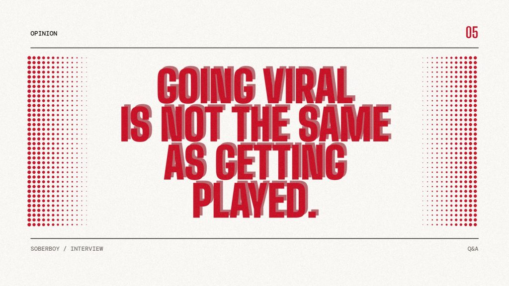 Poster reading "Going viral is not the same as getting played." in heavy red type on paper.
